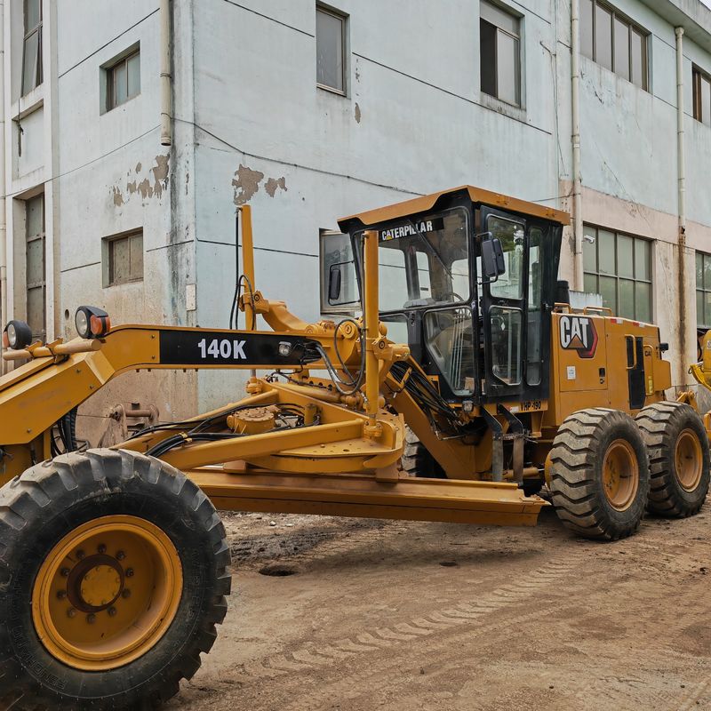 Escavatore usato levigatore Caterpillar CAT140K macchina stradale giapponese di seconda mano motore del trattore in buone condizioni