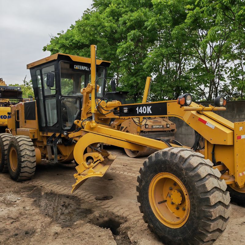 Escavatore usato levigatore Caterpillar CAT140K macchina stradale giapponese di seconda mano motore del trattore in buone condizioni