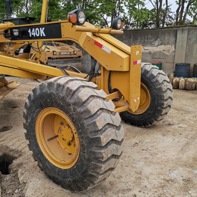 Escavatore usato levigatore Caterpillar CAT140K macchina stradale giapponese di seconda mano motore del trattore in buone condizioni